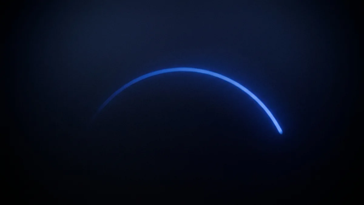 Abstract cobalt-blue sound-wave arc glowing in the dark
